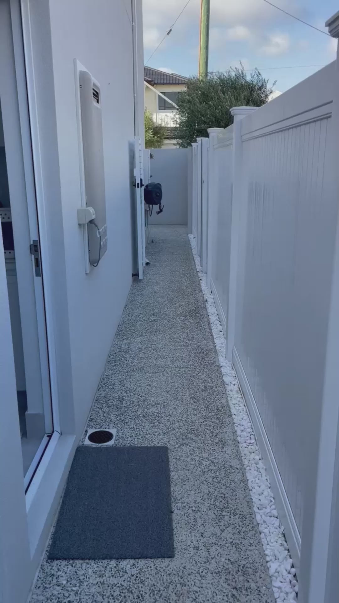 Load video: Video demonstrating the features, installation process, and safety benefits of the GateGuard wireless smart pool gate sensor alarm by Enki Systems in a front yard, designed to enhance pool safety for children and pets.
