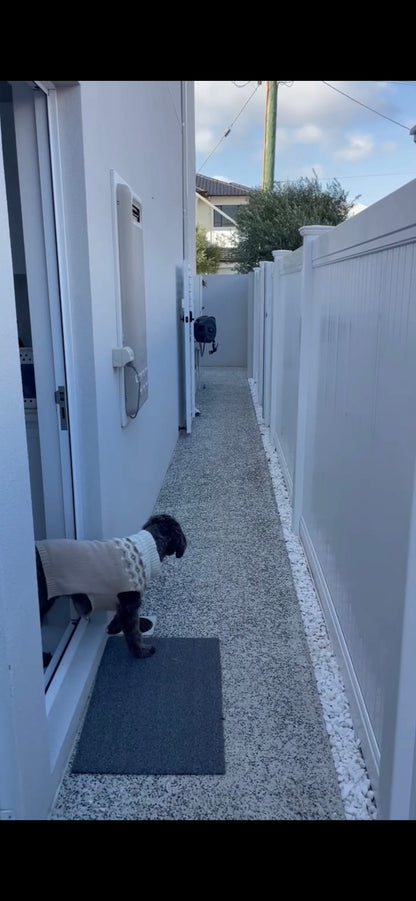 GateGuard smart sensor on dog gate — keep your pet safe
